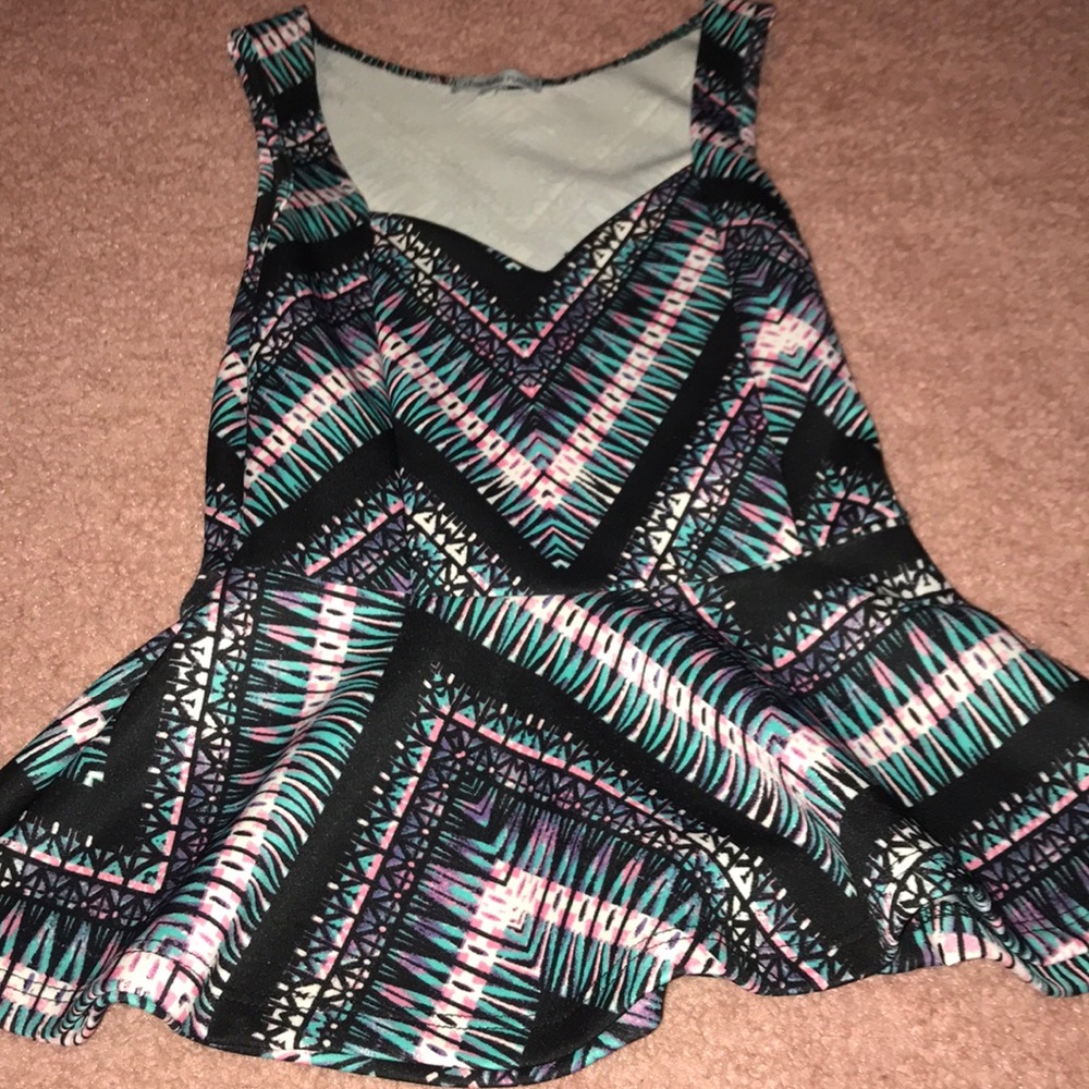 Cute peplum top with fun design!